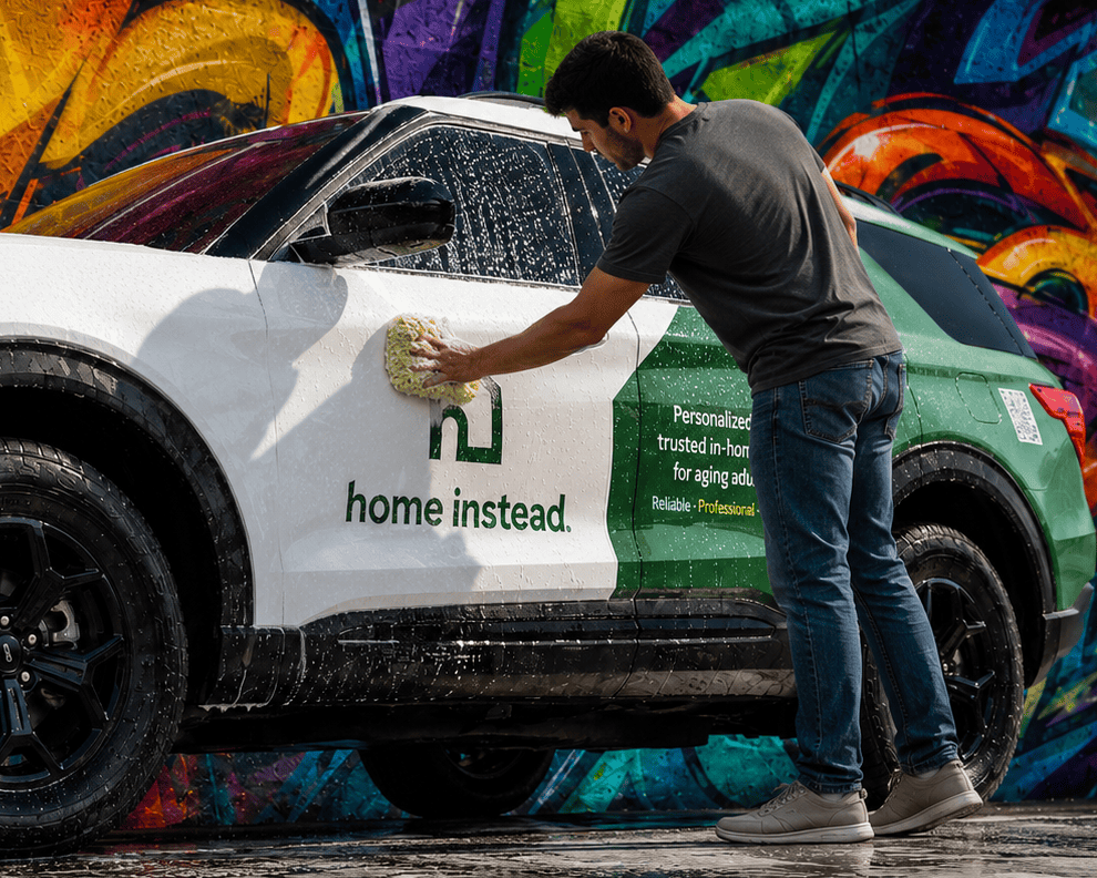 Hand washing a wrapped vehicle with a microfiber wash mitt